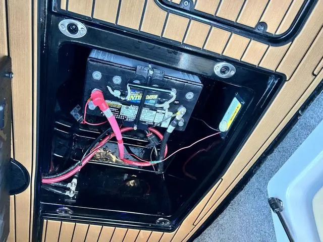 Slide: The Image of Battery compartment of 2022 Nautique G23 boat with wiring and connections. - 20