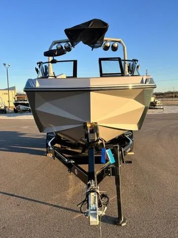 Slide: The Image of 2022 Nautique G23 boat on trailer in parking lot, front view. - 3