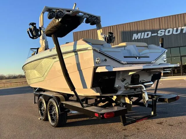 Slide: The Image of 2022 Nautique G23 boat on trailer, parked outside Mid-South building. - 6