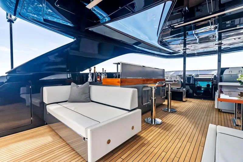 Slide: The Image of Luxurious interior of 2020 Riva 110' Dolcevita yacht with modern seating and bar area. - 21
