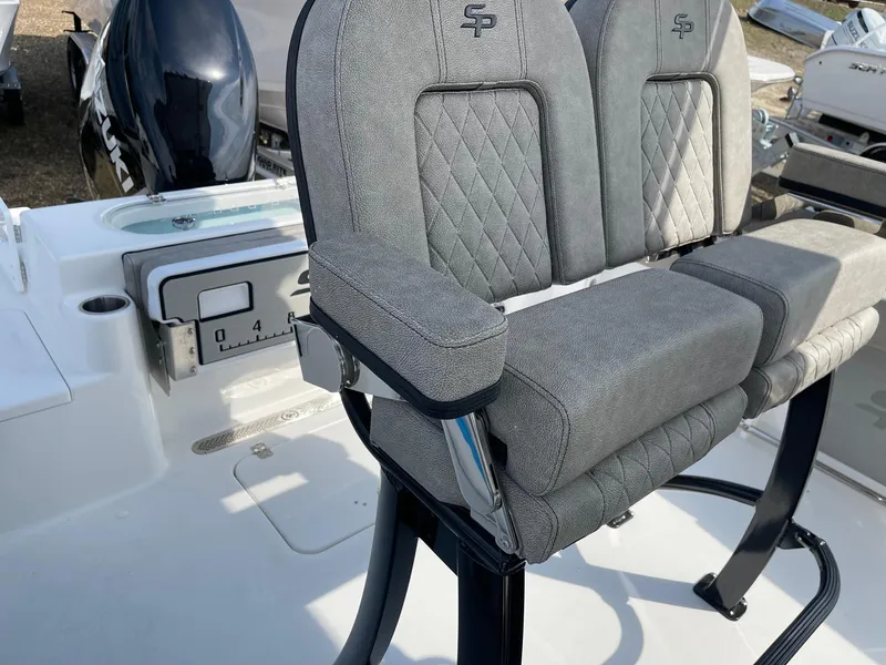 Slide: The Image of 2024 Sea Pro 242 Center Console boat with dual cushioned seats. - 9