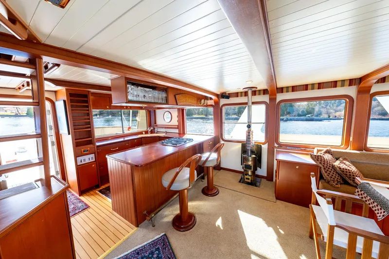 Slide: The Image of Interior of a 2002 North Sea Trawler with wooden furnishings and large windows. - 11