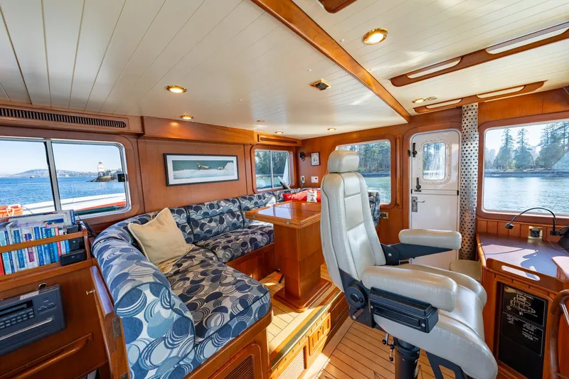 Slide: The Image of Interior of 2002 North Sea Trawler with cozy seating and scenic window views. - 24