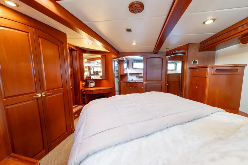 Slide: The Image of Luxurious cabin interior of a 2002 North Sea Trawler with wooden furnishings and cozy bedding. - 29