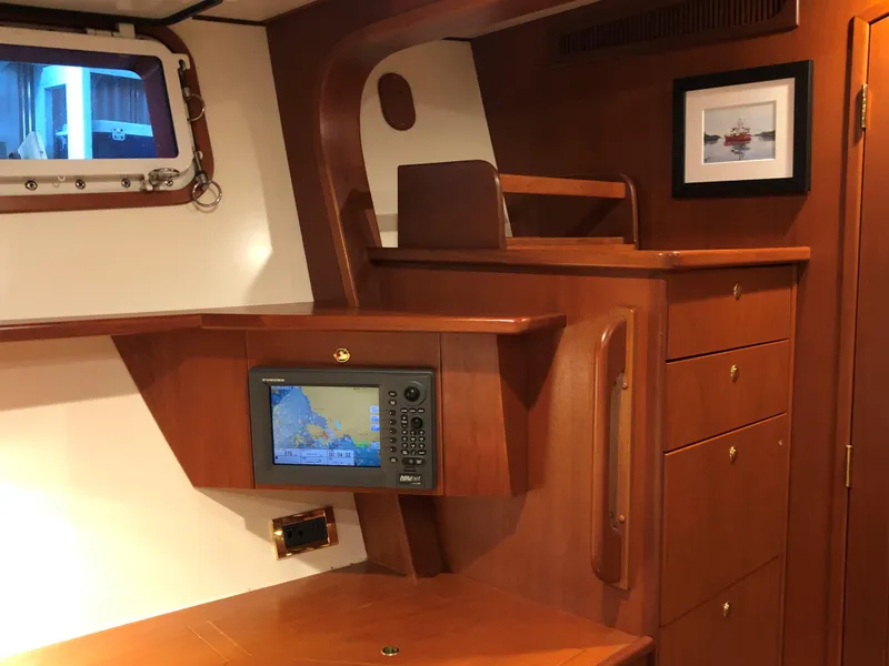 Slide: The Image of Interior of a 2002 North Sea Trawler with navigation equipment and wooden cabinetry. - 30