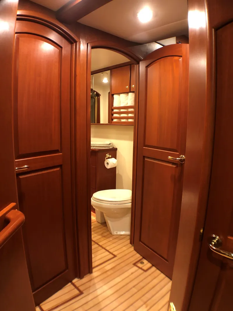 Slide: The Image of Luxurious wooden interior of 2002 North Sea Trawler bathroom with toilet and cabinets. - 37