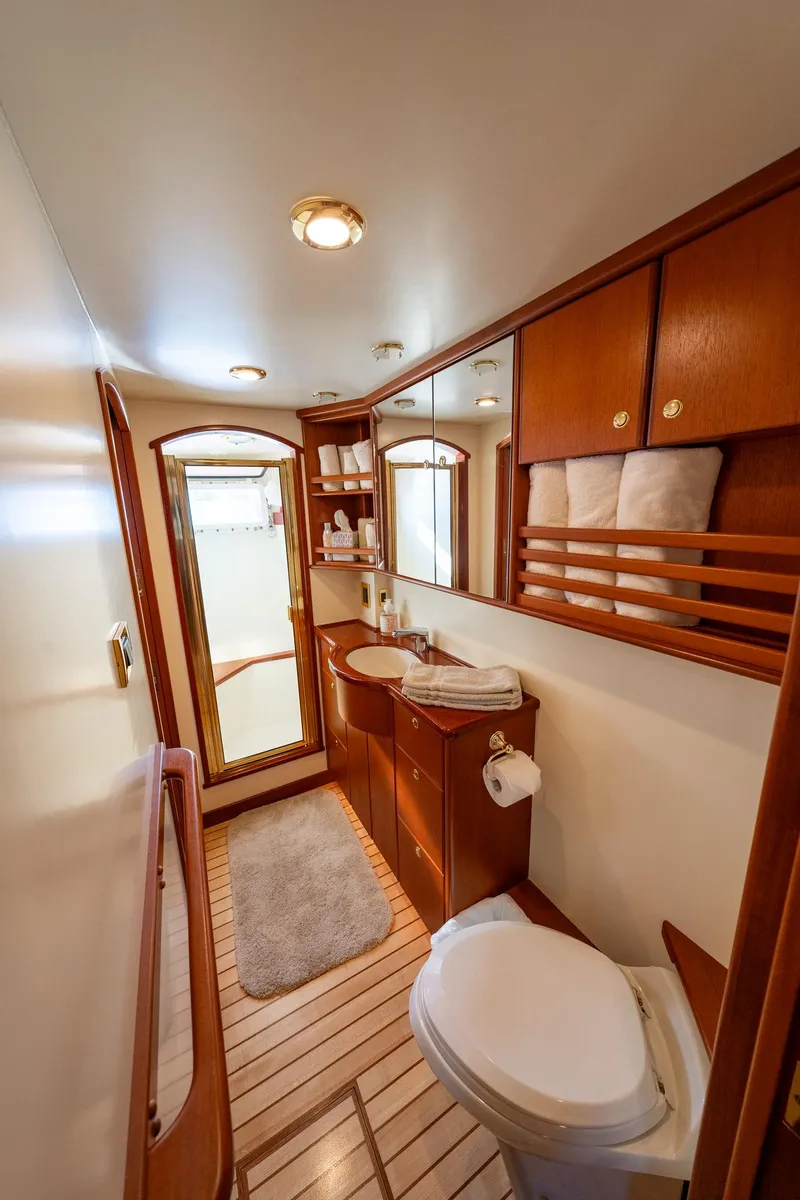 Slide: The Image of Luxurious bathroom on 2002 North Sea Trawler with wooden cabinetry and modern amenities. - 38