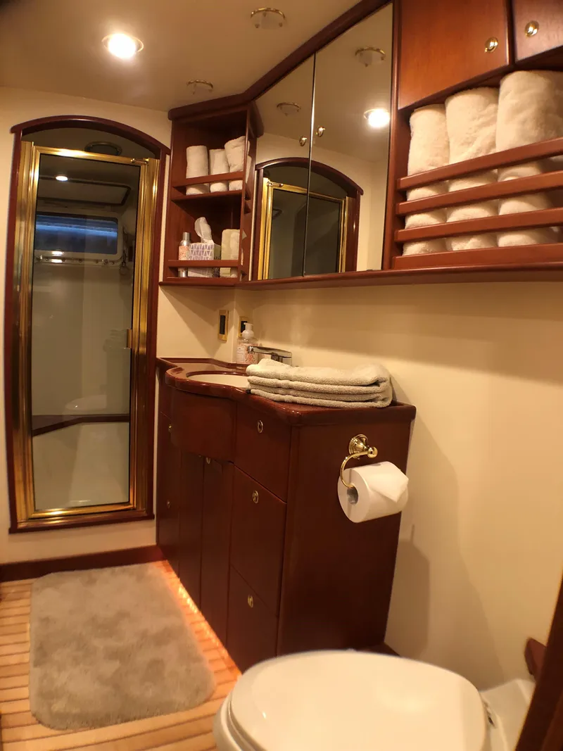 Slide: The Image of Luxurious bathroom on 2002 North Sea Trawler with wooden cabinets and modern amenities. - 39