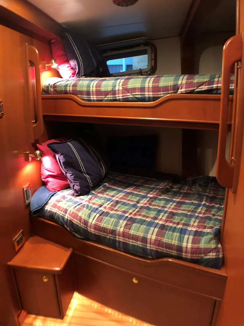 Slide: The Image of Bunk beds in a 2002 North Sea Trawler cabin with plaid bedding. - 41