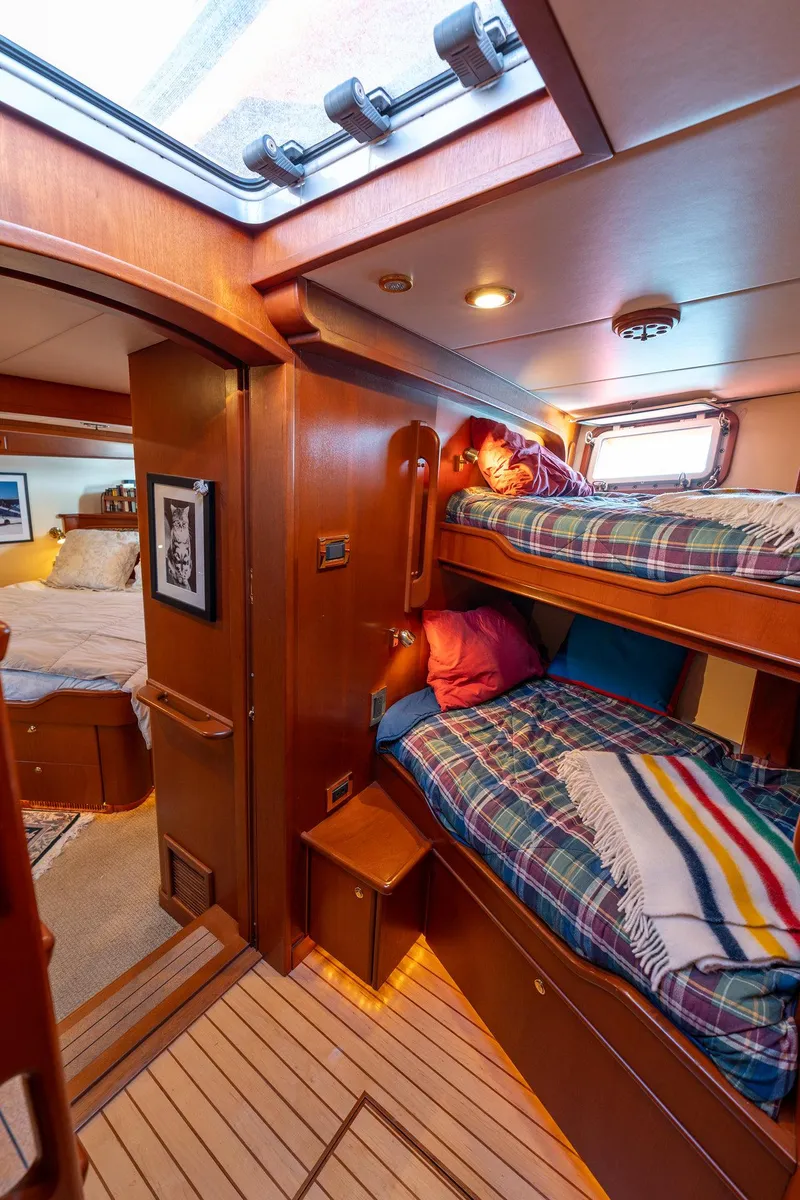 Slide: The Image of Cozy cabin interior of 2002 North Sea Trawler with bunk beds and wooden finish. - 42