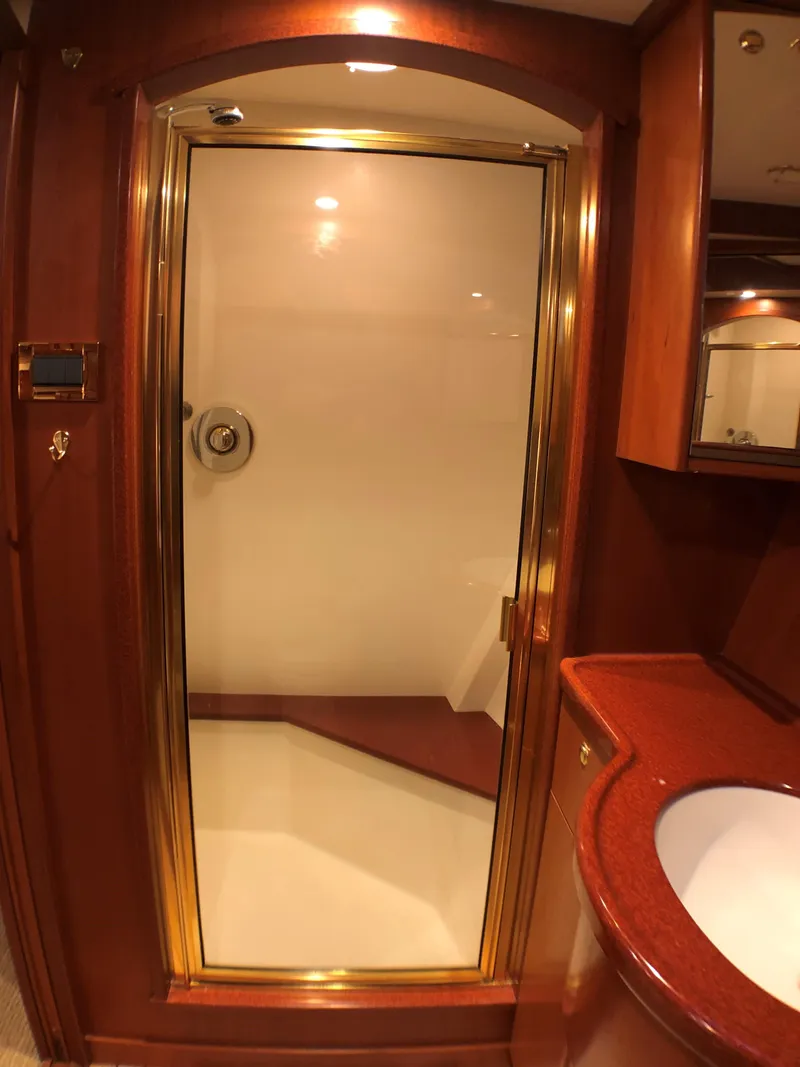 Slide: The Image of Luxurious bathroom interior on 2002 North Sea Trawler, featuring elegant wood and gold accents. - 44