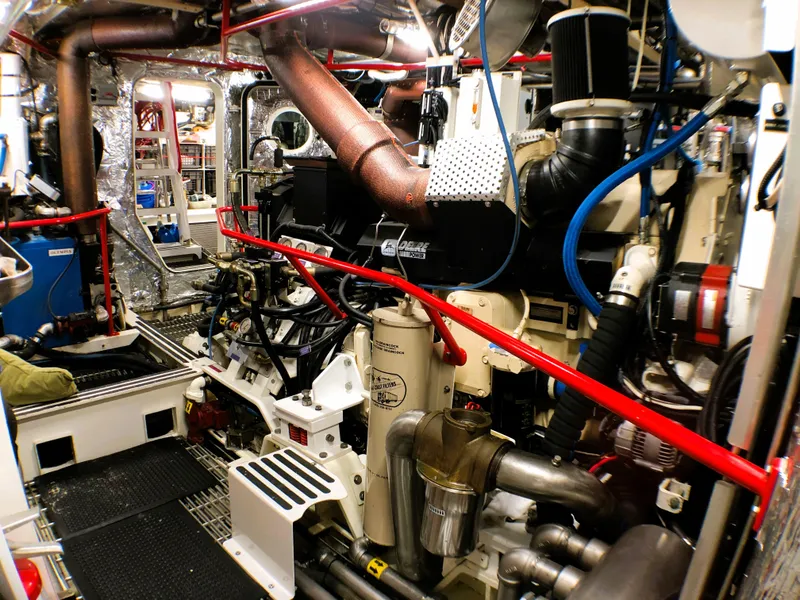 Slide: The Image of Engine room of a 2002 North Sea Trawler, showcasing complex machinery and piping. - 49