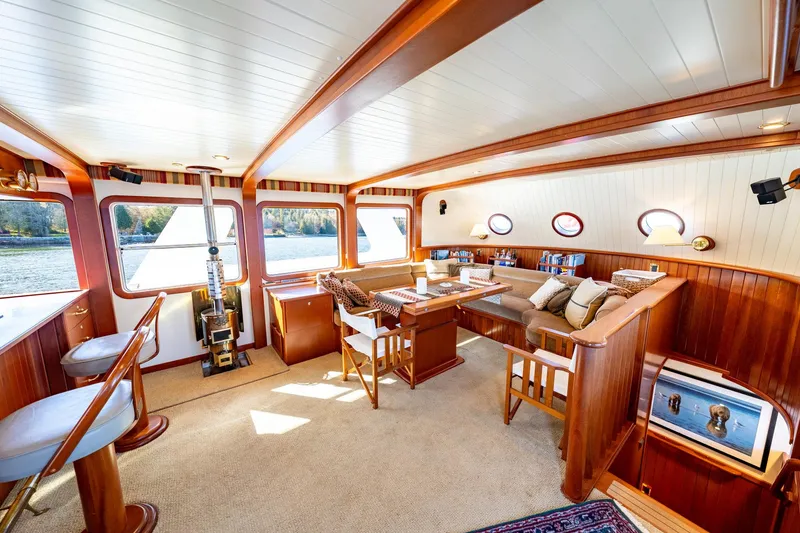 Slide: The Image of Luxurious interior of 2002 North Sea Trawler with elegant wood finish and comfortable seating. - 9