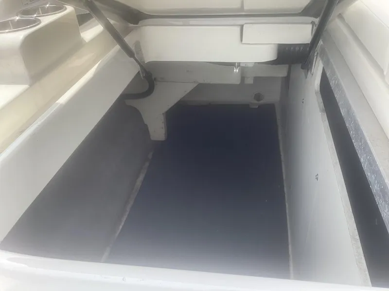 Slide: The Image of Storage compartment of 2017 Sea Ray SDX 270 boat, featuring spacious interior. - 17