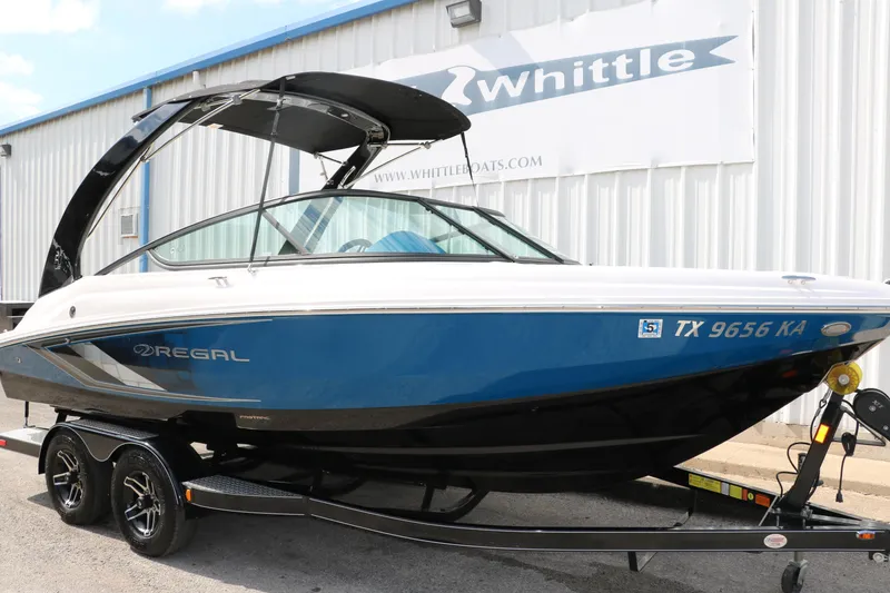 Slide: The Image of 2021 Regal 2000 ESX Bowrider boat on trailer outside Whittle Boats dealership. - 13