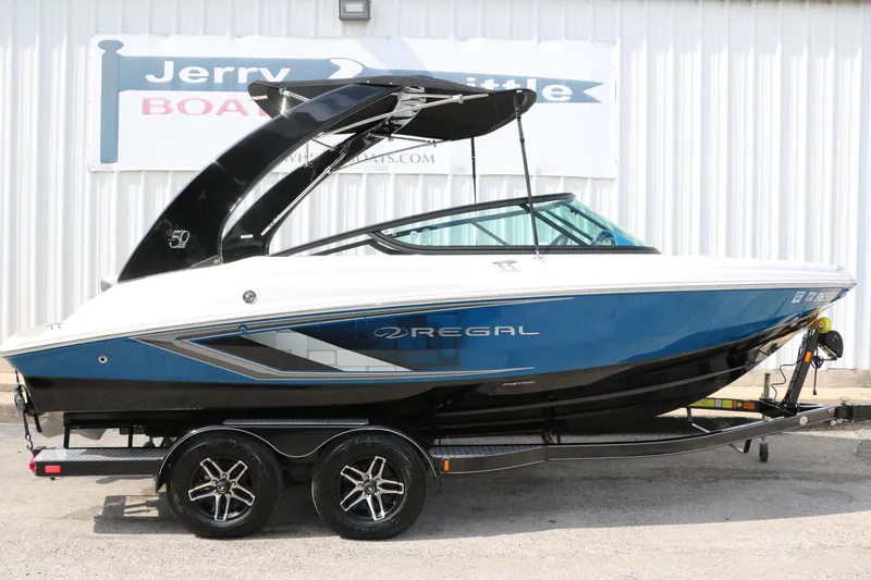 Slide: The Image of 2021 Regal 2000 ESX Bowrider boat on trailer, side view. - 15