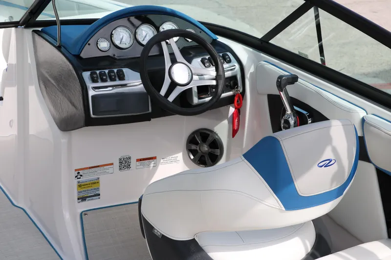 Slide: The Image of 2021 Regal 2000 ESX Bowrider cockpit with steering wheel and control panel. - 20