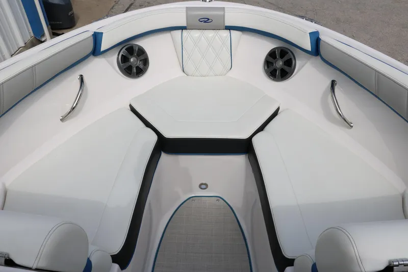 Slide: The Image of 2021 Regal 2000 ESX Bowrider boat interior with white seating and blue accents. - 23