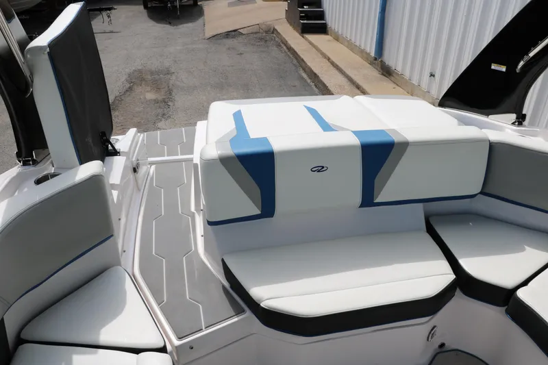 Slide: The Image of 2021 Regal 2000 ESX Bowrider boat interior with white and blue seating. - 30