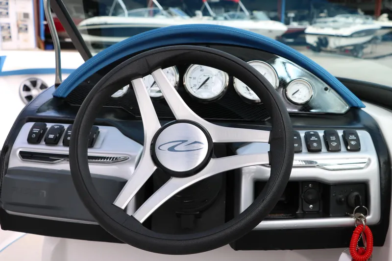 Slide: The Image of 2021 Regal 2000 ESX Bowrider steering wheel and dashboard with gauges and controls. - 34