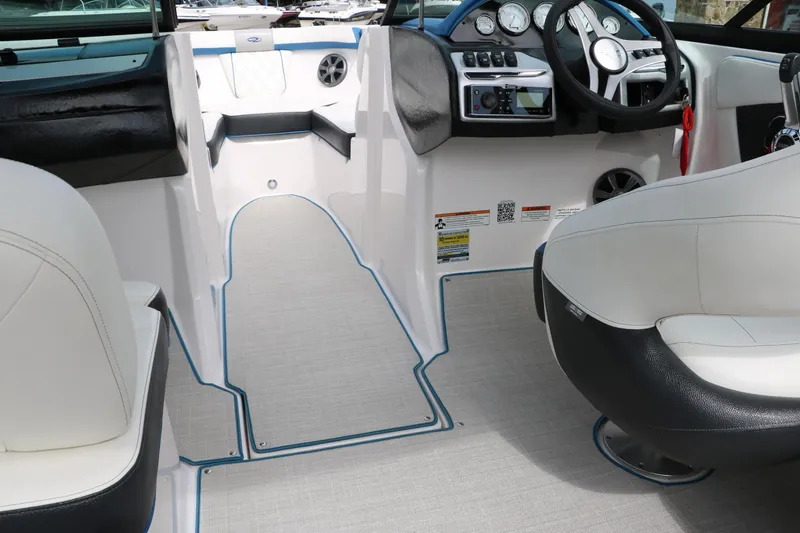 Slide: The Image of 2021 Regal 2000 ESX Bowrider interior cockpit with white and black seating. - 41