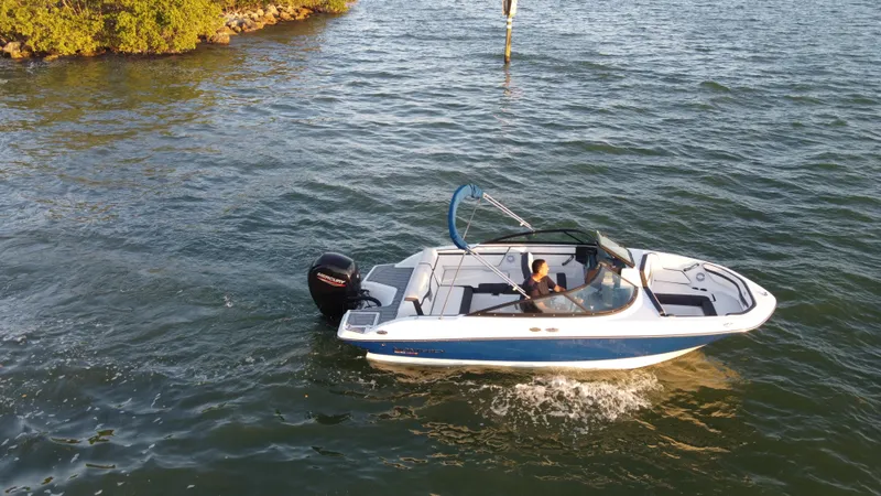 Slide: The Image of 2020 Monterey M205 boat cruising on a lake. - 13