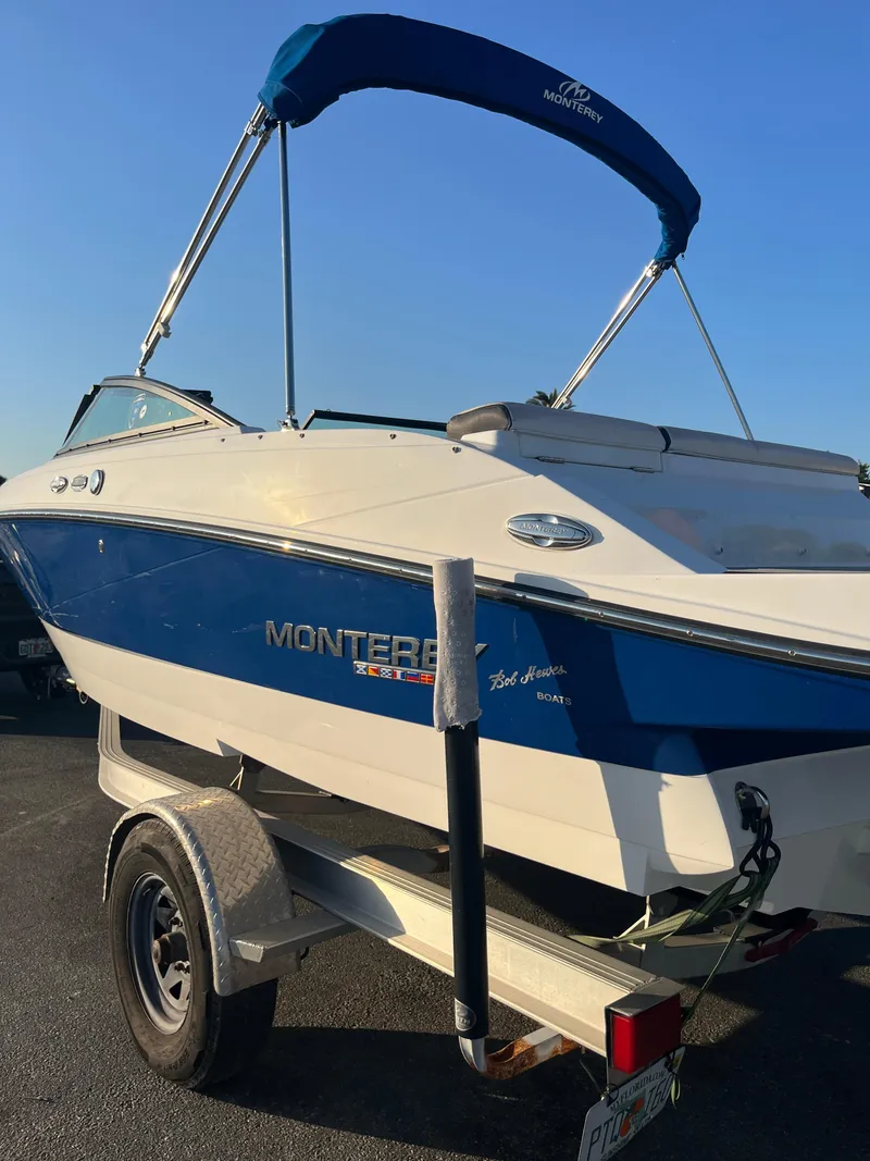 Slide: The Image of 2020 Monterey M205 boat on trailer with blue and white exterior. - 15