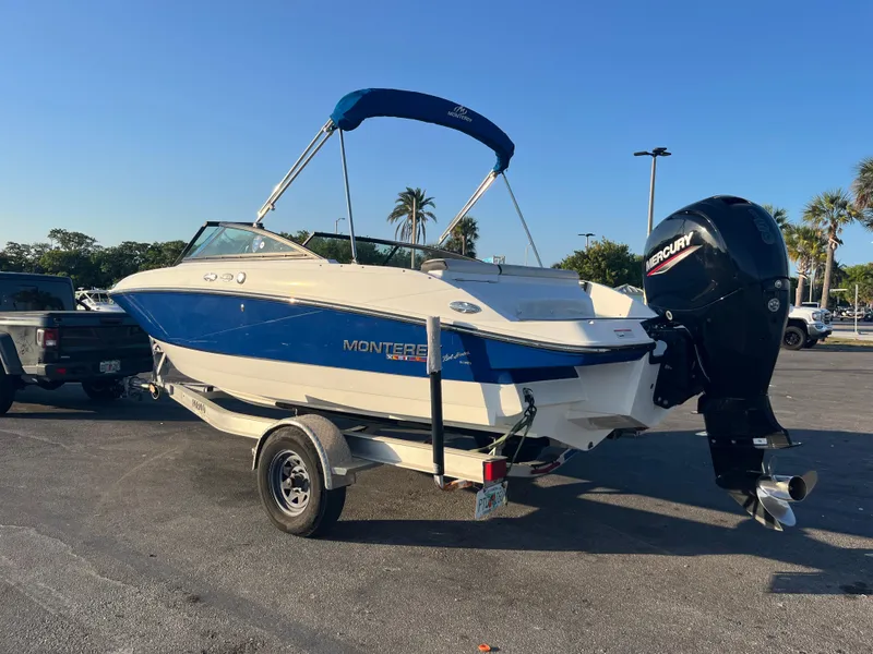 Slide: The Image of 2020 Monterey M205 boat on trailer with Mercury outboard motor. - 18