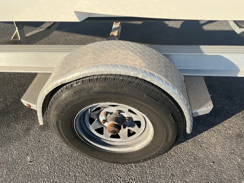 Slide: The Image of Close-up of a 2020 Monterey M205 boat trailer wheel and fender. - 20