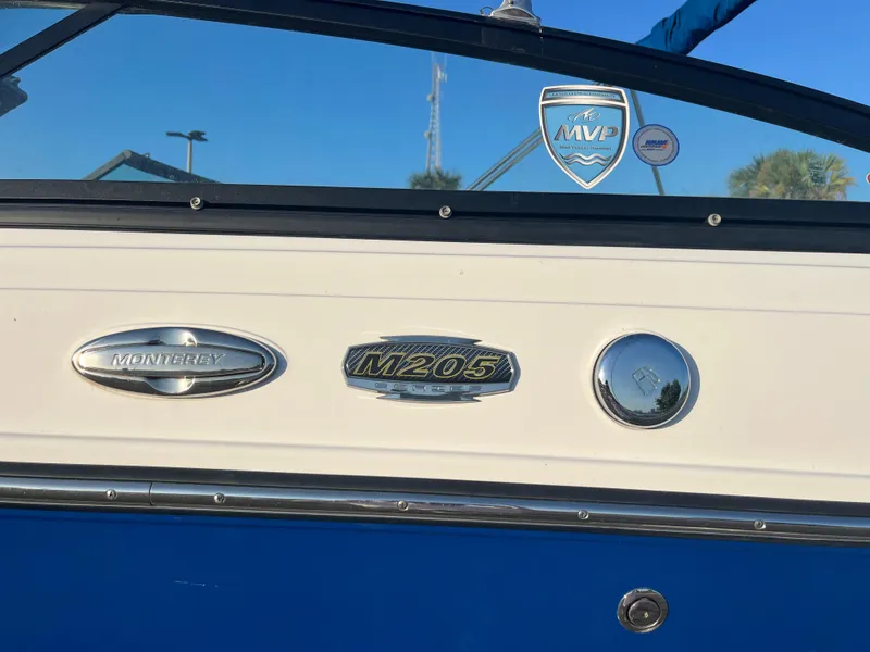 Slide: The Image of 2020 Monterey M205 boat exterior with model badges and MVP sticker. - 24