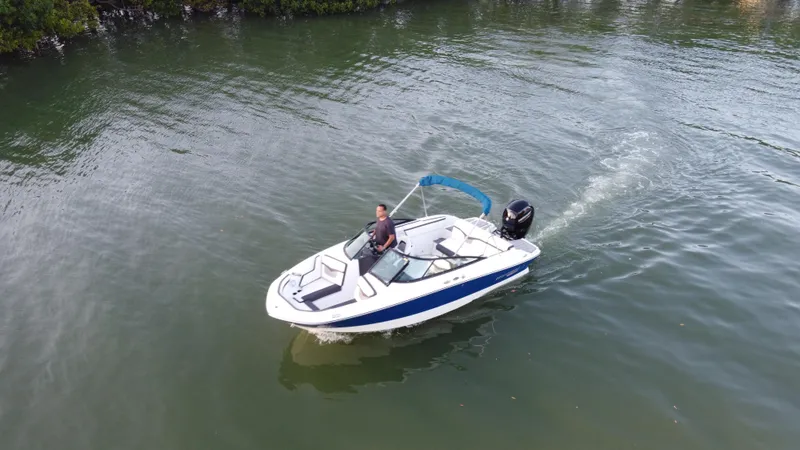 Slide: The Image of 2020 Monterey M205 boat cruising on a calm lake. - 8