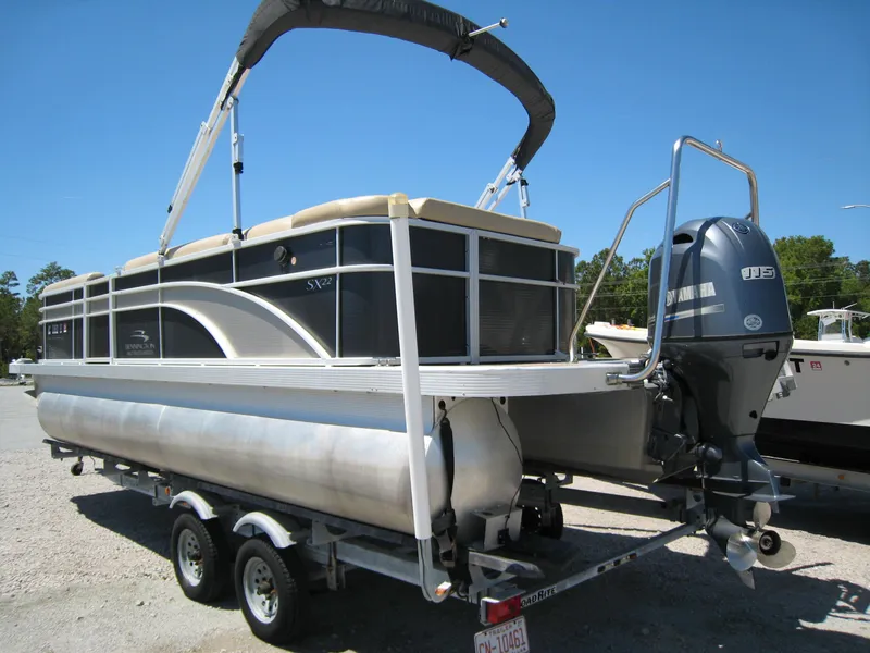Slide: The Image of 2017 Bennington 22SLX pontoon boat on trailer with Yamaha outboard motor. - 4