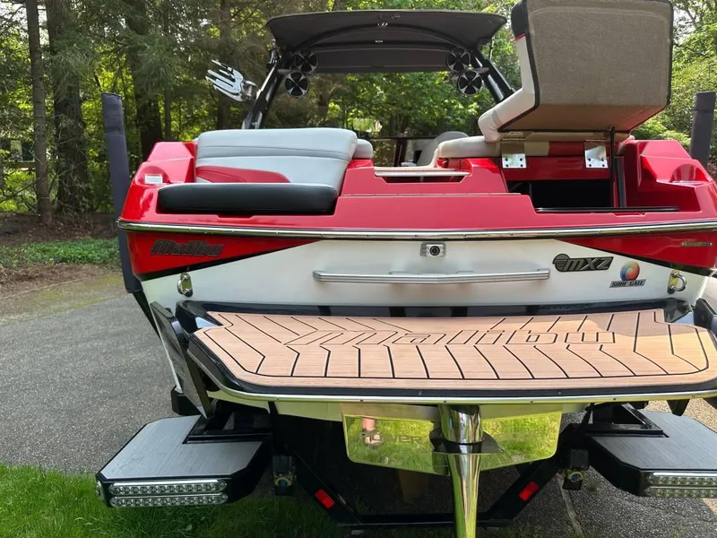 Slide: The Image of 2017 Malibu 24' WAKESETTER MXZ boat, rear view with teak swim platform. - 3