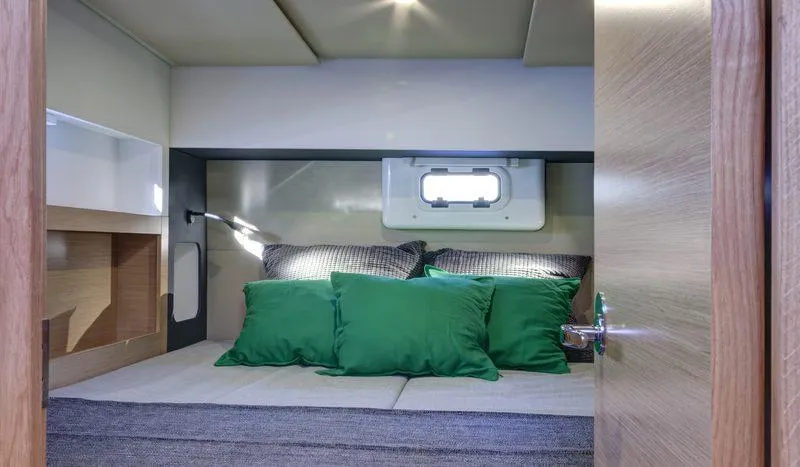 Slide: The Image of Cozy cabin interior of 2016 Nautitech 40 Open catamaran with green pillows. - 9
