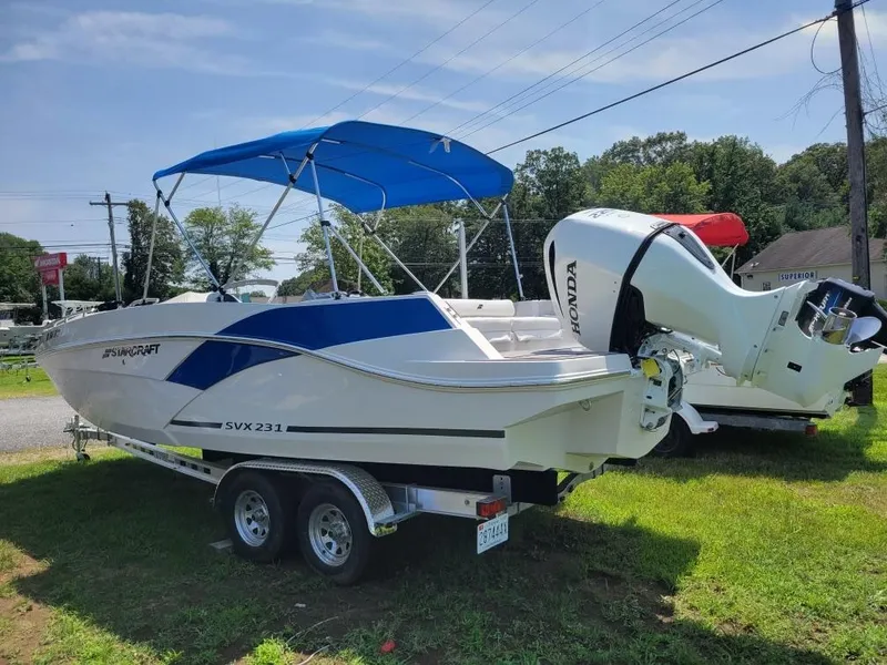 The Image of 2021 Starcraft SVX 231 OB boat with Honda outboard motor on trailer. - 0