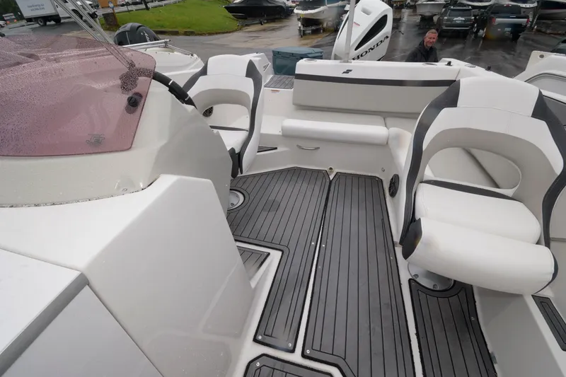Slide: The Image of 2021 Starcraft SVX 231 OB boat interior with seating and deck view. - 6