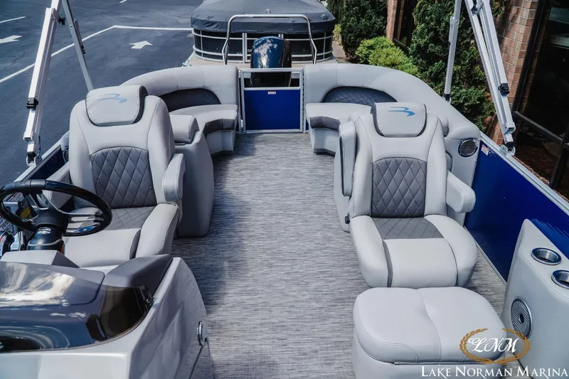 Slide: The Image of 2023 Bennington 23LSR pontoon boat interior with luxurious seating at Lake Norman Marina. - 13