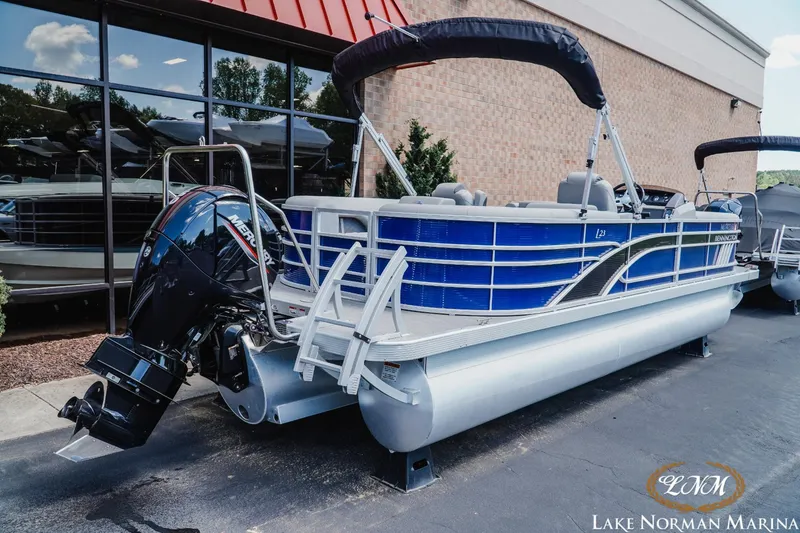Slide: The Image of 2023 Bennington 23LSR pontoon boat with outboard motor at Lake Norman Marina. - 3