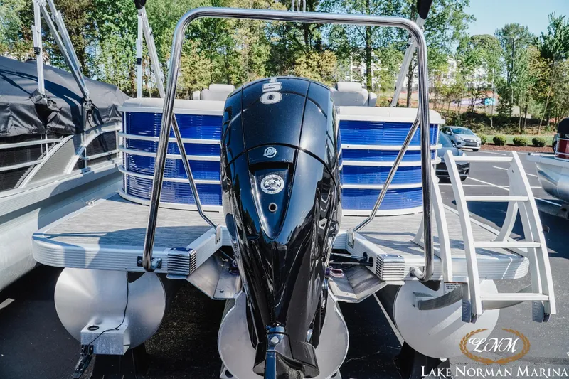 Slide: The Image of 2023 Bennington 23LSR pontoon boat with outboard motor at Lake Norman Marina. - 3