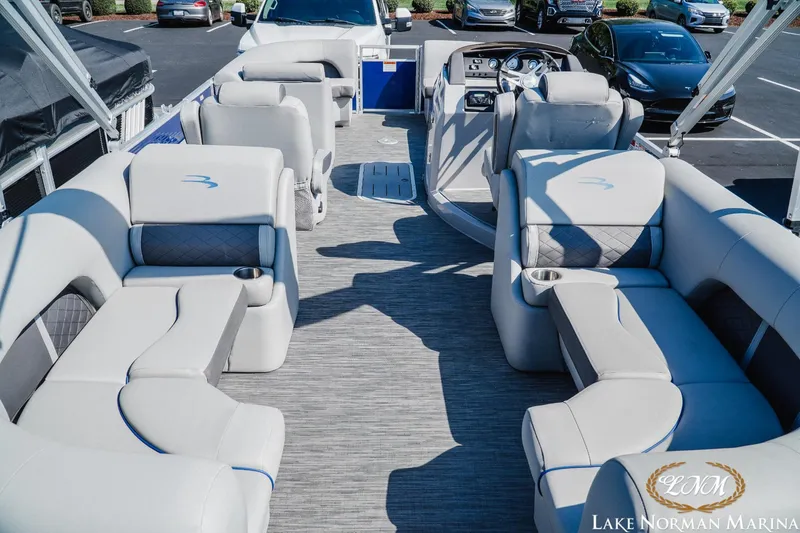 Slide: The Image of 2023 Bennington 23LSR pontoon boat interior with luxurious seating at Lake Norman Marina. - 4