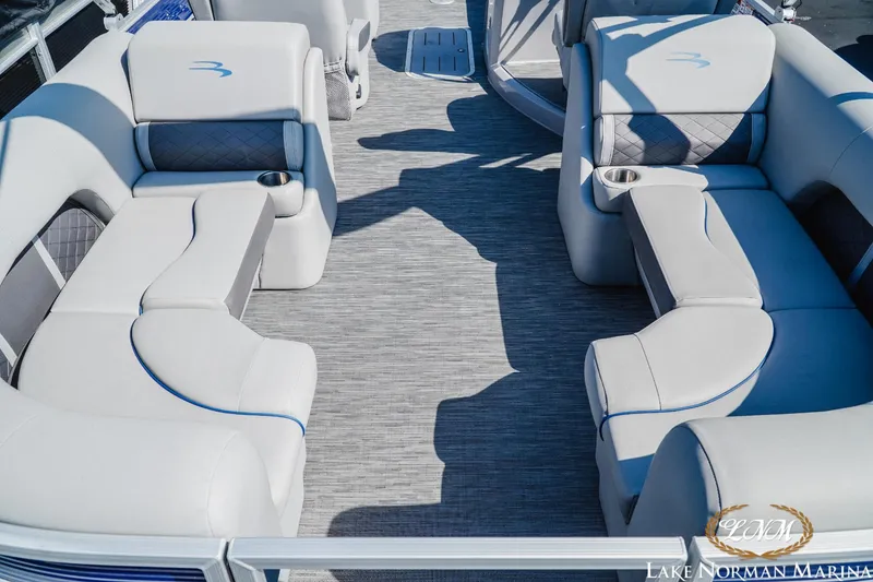Slide: The Image of 2023 Bennington 23LSR pontoon boat interior with plush seating and cup holders. - 5