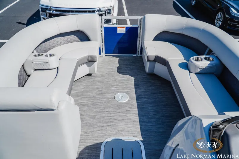 Slide: The Image of 2023 Bennington 23LSR pontoon boat interior with plush seating and cup holders. - 9
