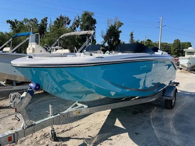 The Image of 2024 Bayliner Element M19 boat on a trailer in a sunny outdoor setting. - 0