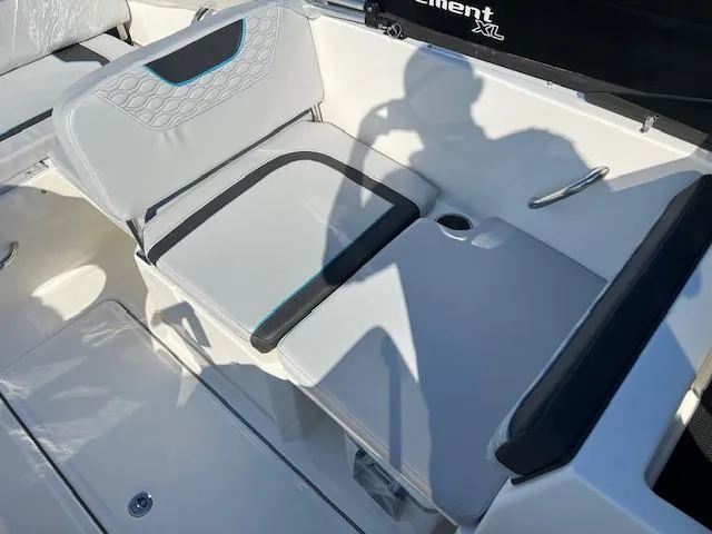 Slide: The Image of 2024 Bayliner Element M19 boat interior seating with cup holder. - 3