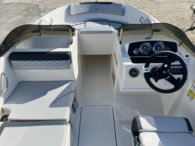 Slide: The Image of 2024 Bayliner Element M19 boat interior with steering wheel and seating. - 6