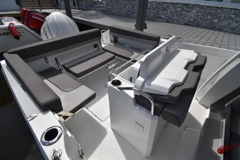 Slide: The Image of 2022 Jeanneau 7.5 Leader boat interior with seating and storage compartments. - 13