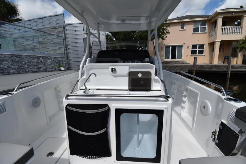 Slide: The Image of 2022 Jeanneau 7.5 Leader boat interior with storage and seating. - 16