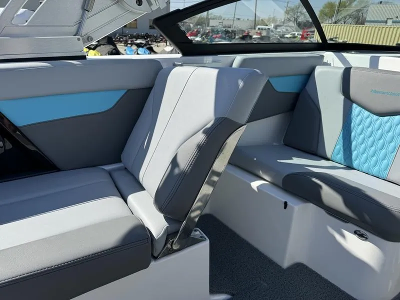 Slide: The Image of 2022 MasterCraft XT24 boat interior with gray and blue seating. - 20