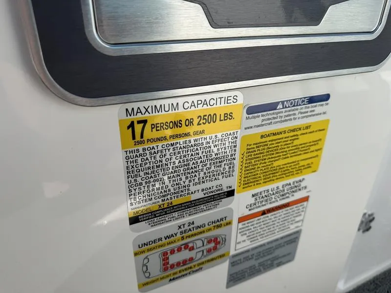 Slide: The Image of 2022 MasterCraft XT24 capacity label: 17 persons or 2500 lbs. - 33