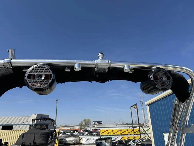 Slide: The Image of 2022 MasterCraft XT24 boat speakers and tower against a clear blue sky. - 36